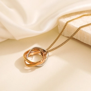 18K gold plated stainless steel necklace with interlocking star pendant on white silk