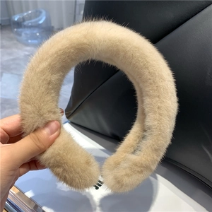 Close-up of light brown mink fur headband showing soft plush texture and elegant design