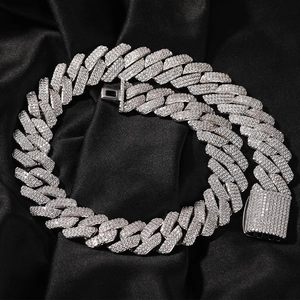 Detailed view of silver Cuban link chain with 20mm width and sparkling zircon stones