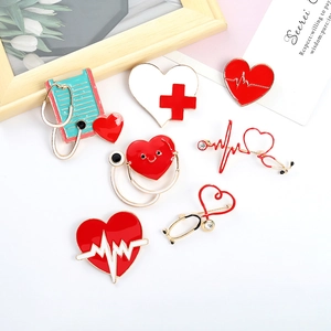 7-piece medical enamel pin set with red heart stethoscope and red cross on wood background