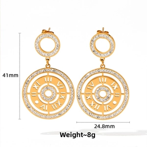 Detail view of gold lucky compass earrings with cubic zirconia and Roman numeral motifs