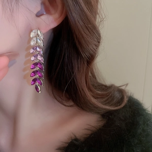 Elegant water drop tassel earrings with purple gradient crystals on a gold base