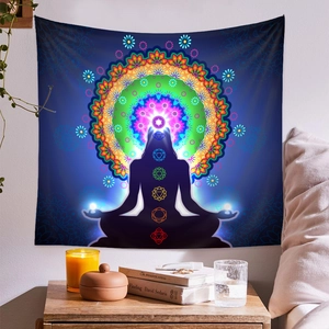 Detailed view of a meditation mandala tapestry featuring seven chakra symbols in a bedroom