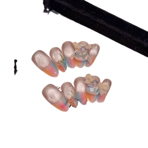 Handmade cat-eye press-on nails with 3D bows, rhinestones and floral gradient art