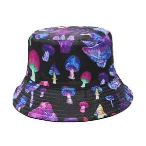 Detail of black reversible bucket hat with colorful neon mushroom print patterns