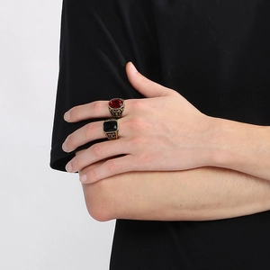 Vintage gold engraved rings for men featuring set red round and black square gemstones