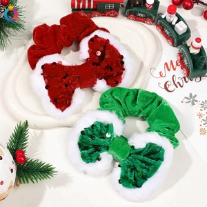 Detail of red and green velvet Christmas scrunchies with white faux fur and sequins