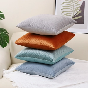 Velvet cushion covers with embossed herringbone pattern in four elegant colors stack