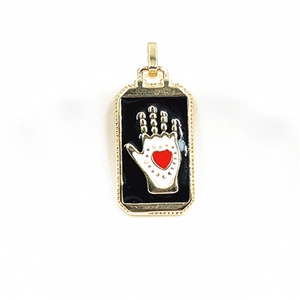 Detailed view of tarot pendant featuring white palm and red heart in golden frame