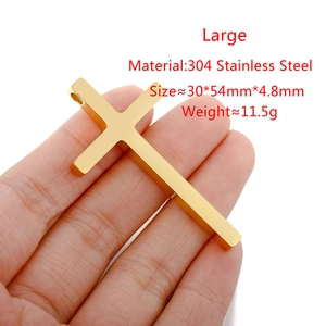 Detail view of large gold stainless steel cross pendant with precise size and weight specs