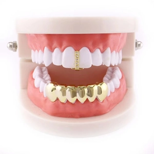 Gold plated hip hop grillz set featuring single zircon tooth and six-tooth lower cap