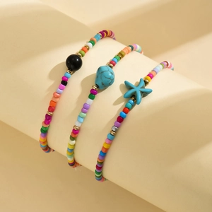 Detail view of 3-piece bohemian anklet set with turquoise and blue starfish beads