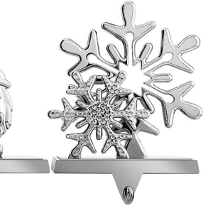 Detailed view of silver metal Christmas stocking holder with snowflake design and hook