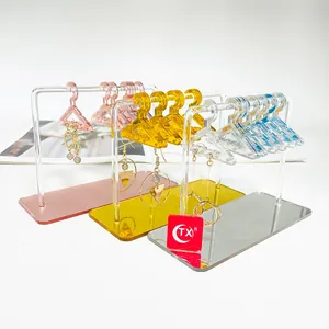 Mini acrylic clothes hanger earring stands in pink, yellow and clear colors