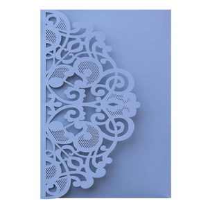 Detail of laser-cut lace pattern on light purple pearlescent paper business invitation