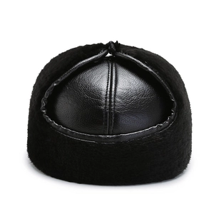 Men's winter black leather baseball cap with faux fur earflaps for thermal protection