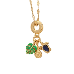 Tropical gold necklace with green leaf, pineapple, and blue turtle pendants