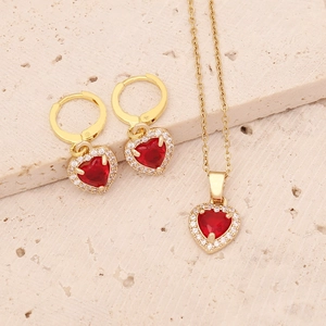Golden heart jewelry set with red zircon stones featuring necklace and earrings