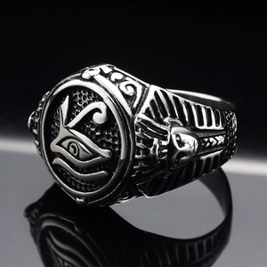 Macro view of Pharaoh and Eye of Horus relief details on vintage stainless steel ring
