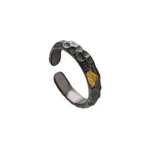 Vintage adjustable ring featuring black lava texture and gold accent on antique silver band