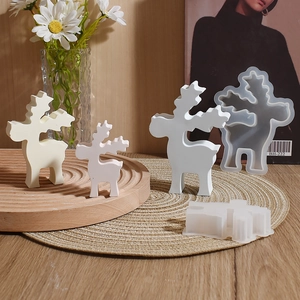 Detailed view of 3D Christmas deer silicone molds and finished resin elk decorations