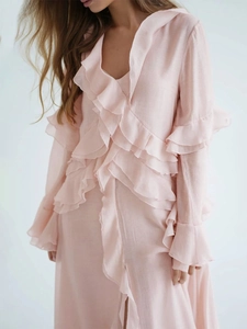 Detail of ruffled V-neck and layered chiffon texture on this dusty rose summer dress