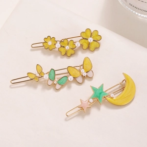 Three Korean-style metal hair clips with pearls, featuring flower, butterfly, and moon stars