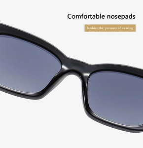 Detailed shot of comfortable nose pads on black cat-eye sunglasses with blue lenses