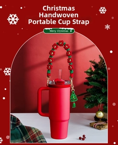Close-up of a handmade Christmas floral woven handle with tree charm on a red tumbler