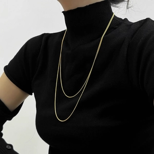Double-layer 18K gold plated snake chain necklace in stainless steel on a model