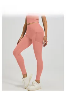 Close-up of high-waist yoga leggings with a practical side mesh pocket in pink