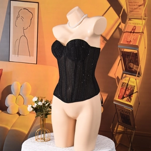 Macro detail of sexy black corset top with glitter stripes and supportive boning structure