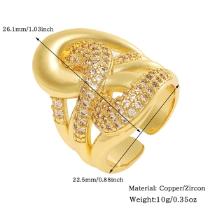 Detailed view of intertwined gold copper ring with zircon pavé and size measurements