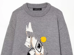 Close-up of intricate horse embroidery on a grey round neck knit sweater fabric