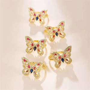 Group of copper butterfly rings with micro-set multicolored cubic zirconia in gold