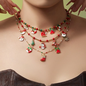 Three-layer Christmas necklace with Santa, tree, and bell pendants in red and green enamel