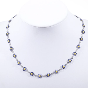 Detail of blue daisy floral necklace with yellow center and silver chain on model