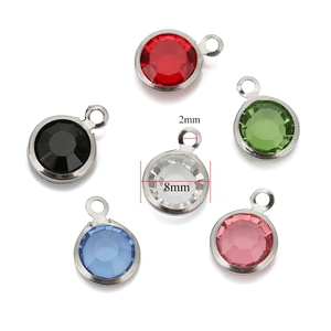 Detail of 8mm colorful crystal pendants with gold stainless steel frames and size marks