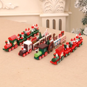 Festive Christmas wooden train ornaments with Santa and snowman on a beige tabletop