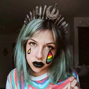 Gothic crown with dark crystals and silver moon worn by a model with teal hair
