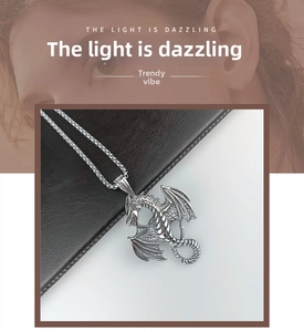Detailed view of silver dragon pendant with intricate scales and pearl chain necklace
