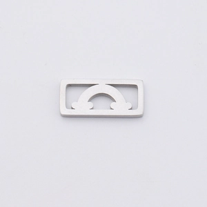 Close-up of hollowed-out rainbow and cloud pendant made of mirror polished stainless steel