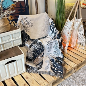 Bohemian woven camping blanket with Great Wave off Kanagawa pattern and decorative fringes
