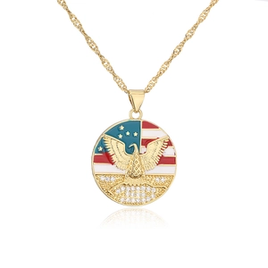 Detail of 18K gold plated necklace with American flag and eagle pendant featuring zircons