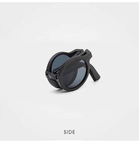 Folded view of children's matte black round sunglasses showing compact portable design