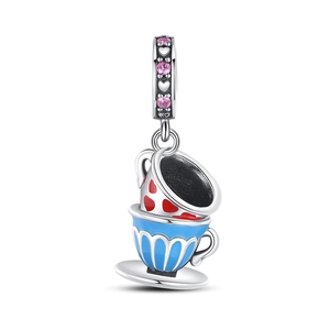 Detailed view of silver tea cup charm with blue enamel and pink zircon stones