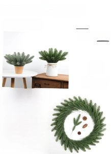 Close-up of artificial pine needle branches and Christmas wreath with natural pine cones