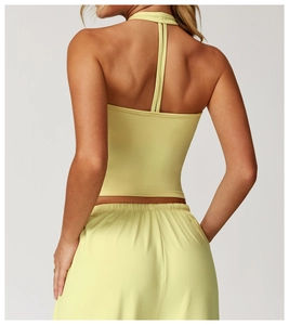 Back view of a light yellow brushed yoga vest with H-shaped halter neck and stretchy fabric