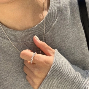 Minimalist 925 sterling silver knotted hollow ring shown worn on index finger
