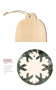 Detail of laser-cut wooden Christmas ornaments with snowflake and bell shapes